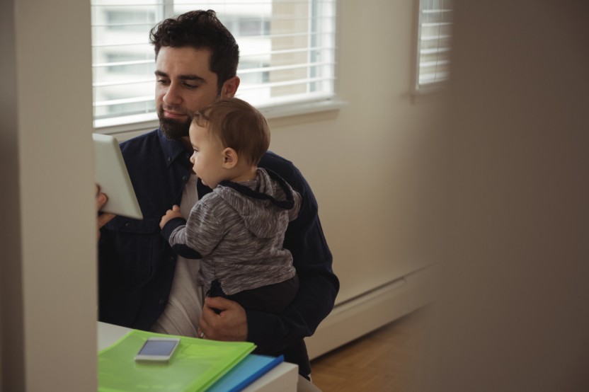 A father holding his son